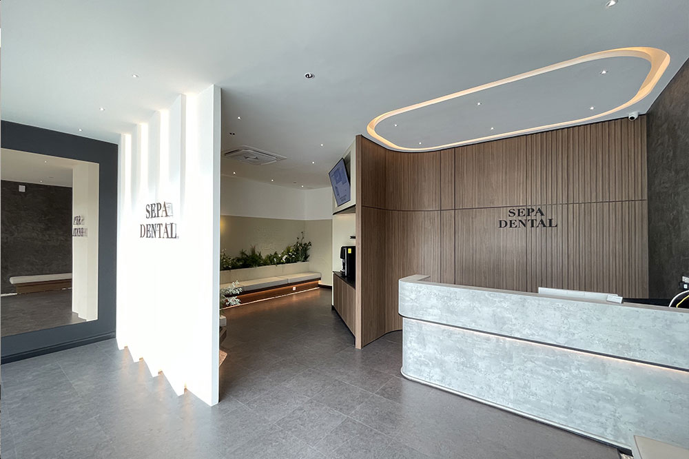 Modern dental clinic hallway with treatment rooms and seating area